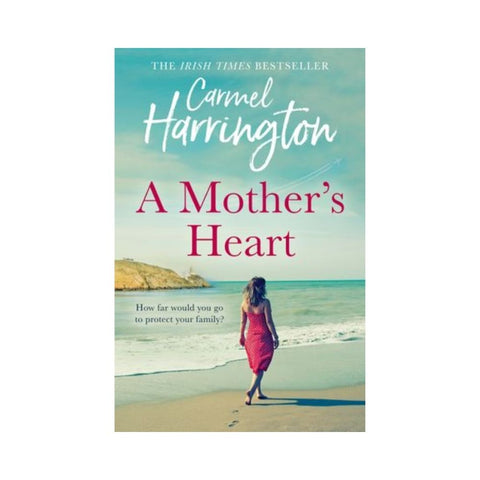 Book cover of 'A Mother's Heart' by Carmel Harrington with a woman walking on a beach.