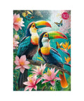 Jigsaw puzzle with two colorful toucans on a branch surrounded by flowers and butterflies, brand 'Cherry Puzzle' visible.