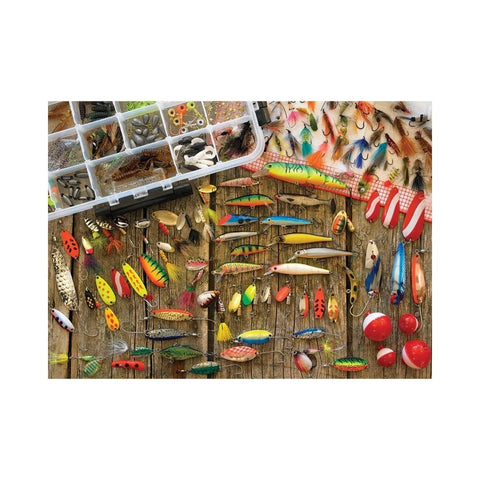 Collection of various fishing lures on a wooden background with a tackle box.