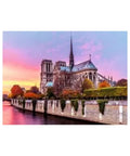 Notre-Dame Cathedral with a colorful sky over a body of water