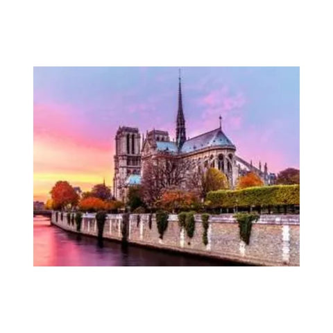 Notre-Dame Cathedral with a colorful sky over a body of water